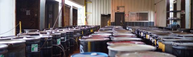 Warehouse storage area with rows of barrels 