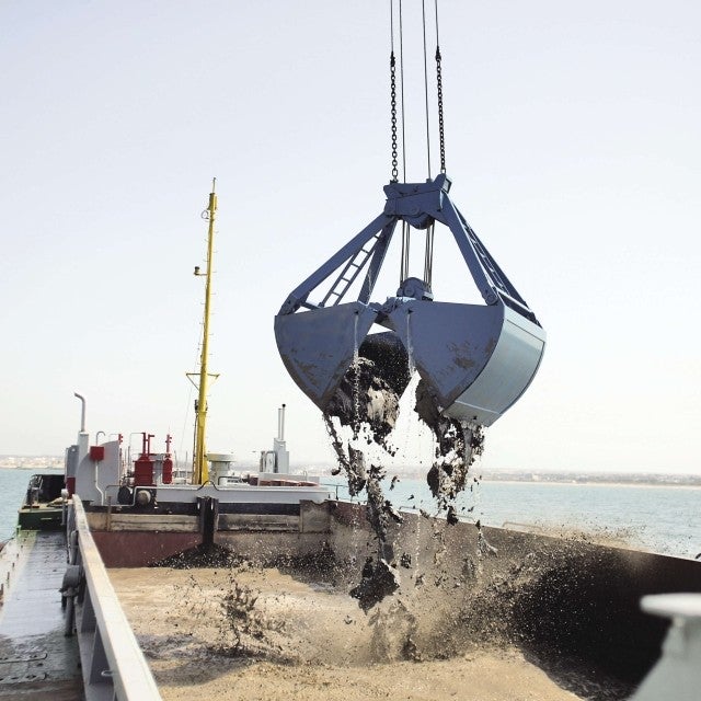 processing dredged material on a barge