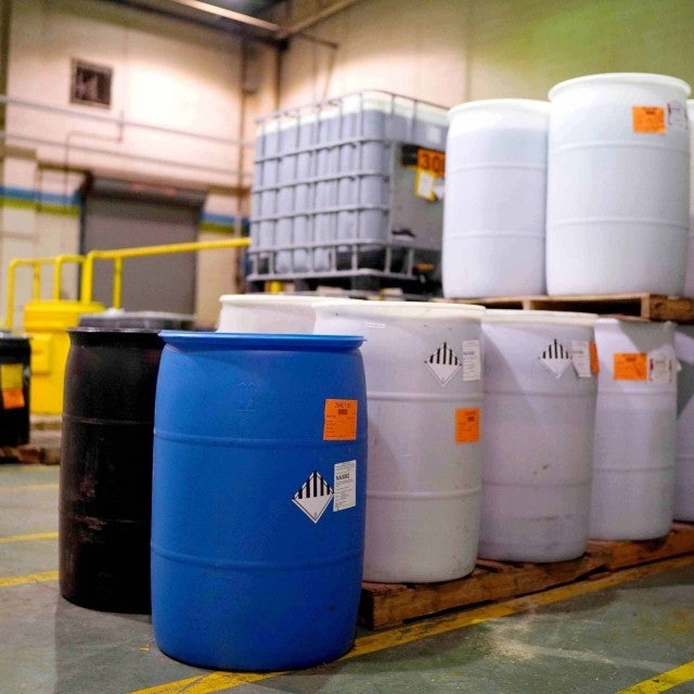 hazardous waste barrels in warehouse