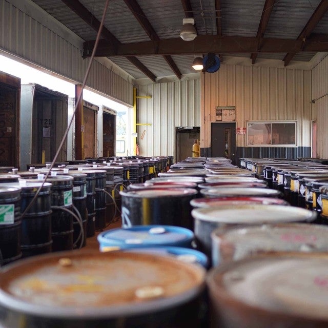Warehouse storage area with rows of barrels 
