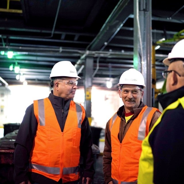 Team talking inside warehouse 