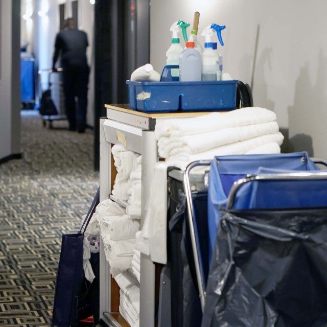 cleaning cart in hotel hallway