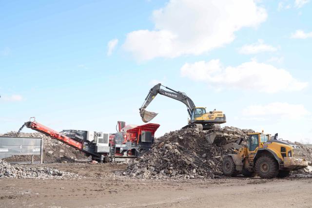 Carteret sifting soil at worksite 