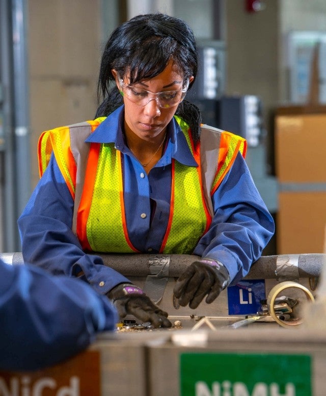 woman battery sorting