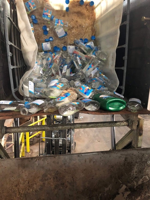 Packaged liquid soap going into shredder