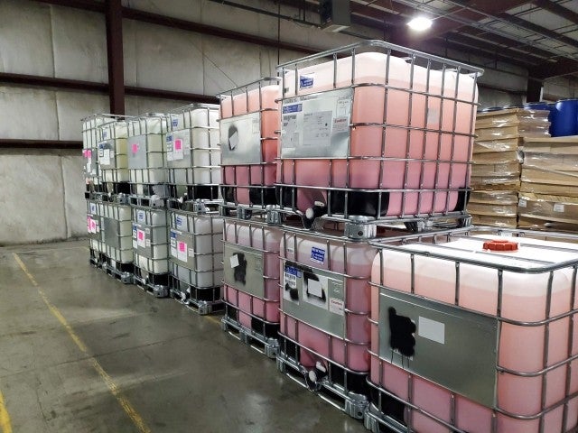 Rows of bulk compost in storage tanks