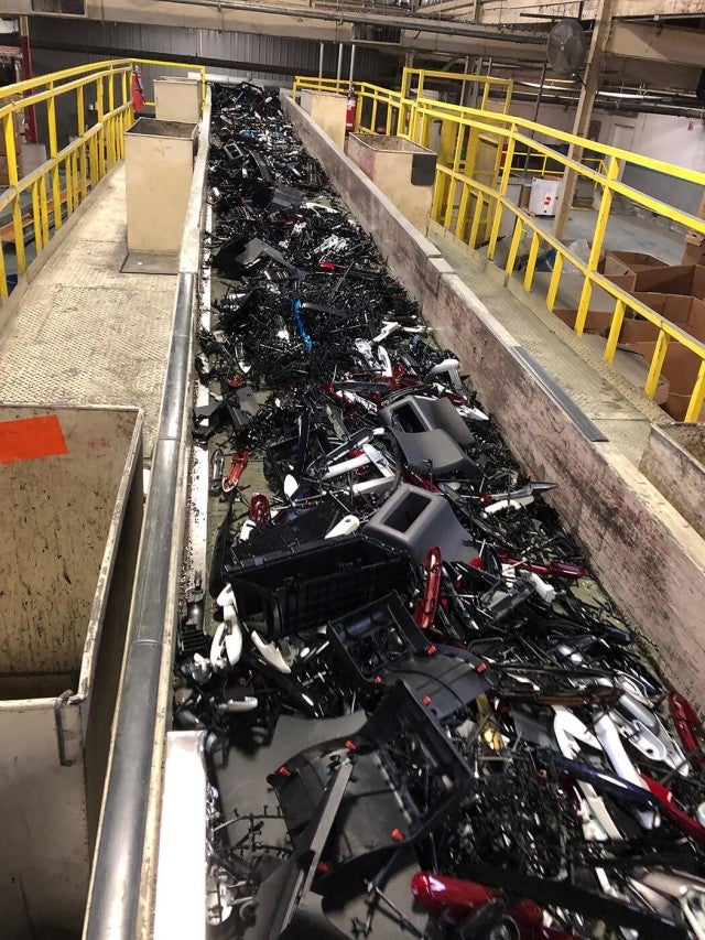 Plastic parts on conveyor belt for recycling