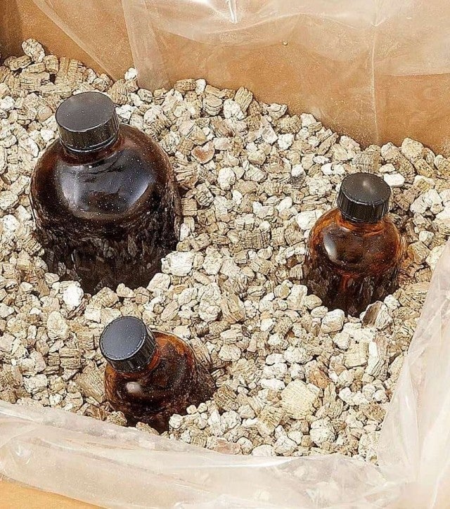 bottled packed in box of vermiculite