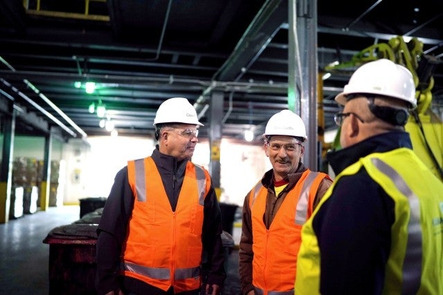 Team talking inside warehouse